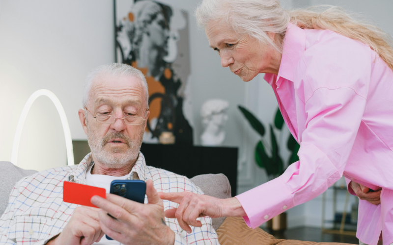 Senior couple checking a phone plan together while reading consumer cellular reviews