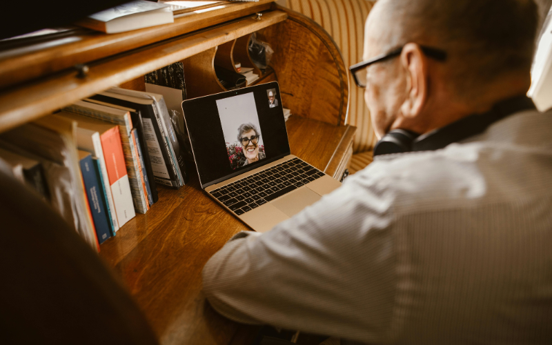 Older man video calling family at home, Is Consumer Cellular good for connection