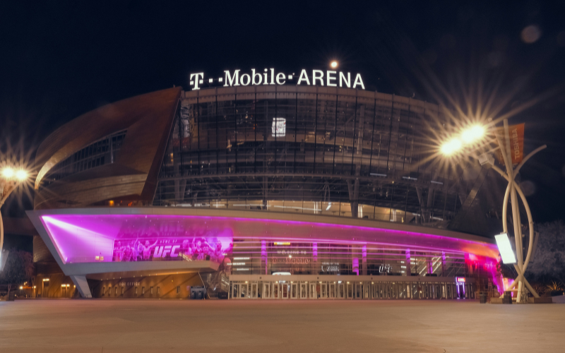 t mobile locations brand signage glowing at night on a landmark building