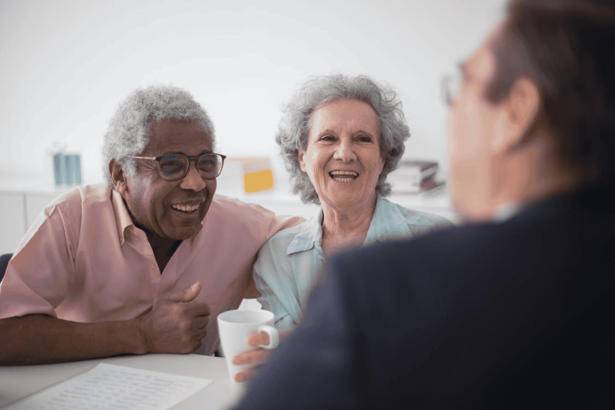Couple meeting with advisor to learn about board and care homes and personalized senior living options