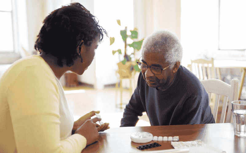 Senior receiving medication support in a board and care home