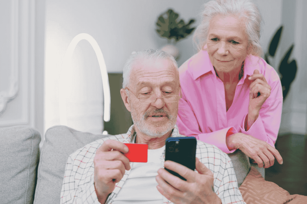 Seniors reviewing Cricket phone plans on a smartphone