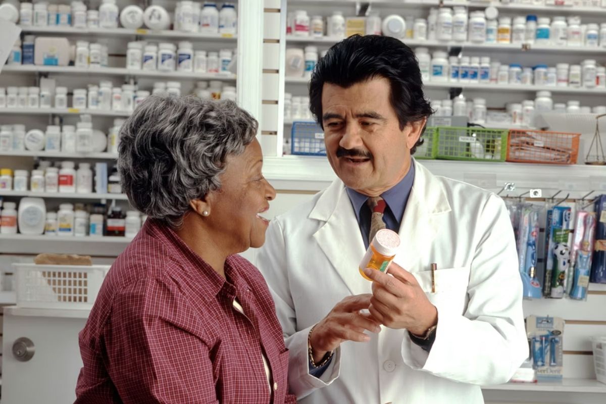 Customer speaking with a pharmacist while researching is goodrx care legit for prescription savings