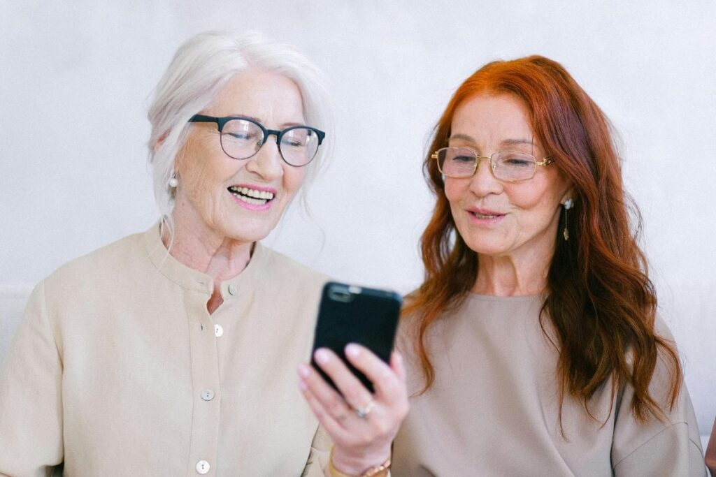 Seniors women reviewing an easy-to-use jitterbug phone for seniors