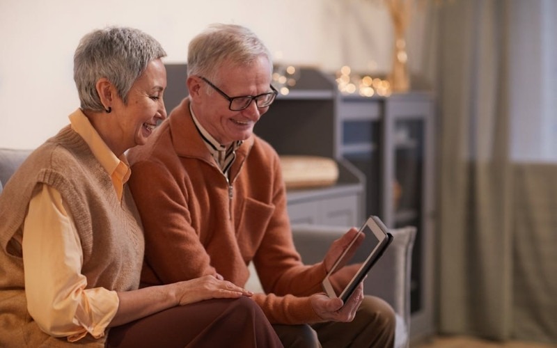 Senior couple using a free iPad for health services and daily communication through Lifeline program support